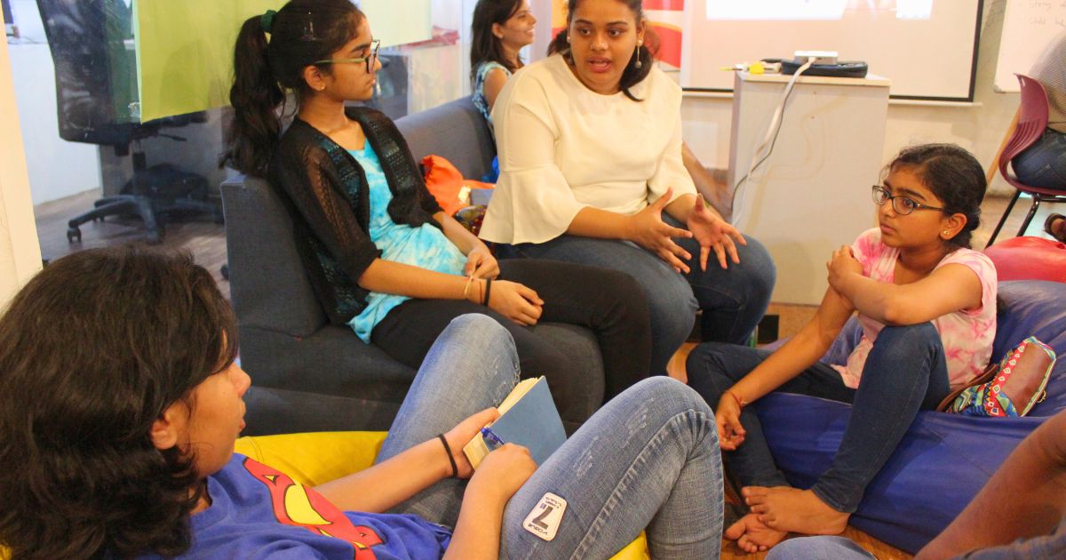 Teens working through an AI challenge